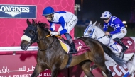 Jockey Alberto Sanna guides Al Maqam to victory. 