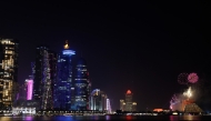 Fireworks light up the sky over the West Bay district in Doha on February 18, 2025. (Photo by KARIM JAAFAR / AFP)
