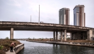 A man fishes inside the Eko Atlantic city project in Lagos, on February 19, 2025. (Photo by OLYMPIA DE MAISMONT / AFP)