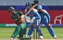 Bangladesh's Towhid Hridoy (L) plays a shot as India's wicketkeeper KL Rahul (C) watches during the ICC Champions Trophy one-day international (ODI) cricket match between Bangladesh and India at the Dubai International Stadium in Dubai on February 20, 2025. (Photo by Fadel Senna / AFP)