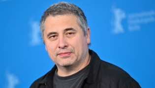 Romanian director Radu Jude poses during a photo call for the film 