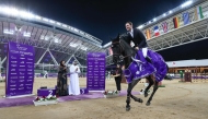 France's Simon Delestre celebrates after winning the CSI5* 1.50m on the opening day of CHI Al Shaqab 2025 at the Longines Outdoor Arena. The winners were crowned by CEO of Qommunication Dr. Noura Bouhalika.