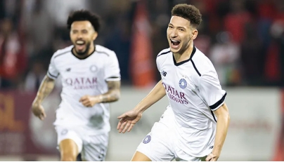 Al Sadd’s Mostafa Mashaal celebrates after scoring his team’s opening goal against Al Duhail.