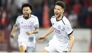 Al Sadd’s Mostafa Mashaal celebrates after scoring his team’s opening goal against Al Duhail.