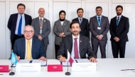 Permanent Representative of Qatar to UN Office in Geneva H E Dr. Hind Abd Al Rahman Al Muftah and others look as CRA President Engineer Ahmad Abdulla AlMuslemani (right) and ITU Radio Communication Bureau Director, Mario Mankiewicz sign the MoU. 