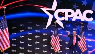 US President Donald Trump dances after speaking at the annual Conservative Political Action Conference (CPAC) in Oxon Hill, Maryland, on February 22, 2025. (Photo by Roberto Schmidt / AFP)