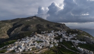 An aerial view shows the main town of Amorgos, on the Greek island of Amorgos, in the Aegean Sea, on February 15, 2025. (Photo by Angelos Tzortzinis / AFP)
