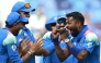 India's Hardik Pandya (R) celebrates with teammates after taking the wicket of Pakistan's Saud Shakeel during the ICC Champions Trophy one-day international (ODI) cricket match between Pakistan and India at the Dubai International Stadium in Dubai on February 23, 2025. (Photo by Jewel SAMAD / AFP)
