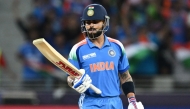 India's Virat Kohli looks at his bat during the ICC Champions Trophy one-day international (ODI) cricket match between Pakistan and India at the Dubai International Stadium in Dubai on February 23, 2025. (Photo by Jewel SAMAD / AFP)