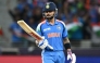 India's Virat Kohli looks at his bat during the ICC Champions Trophy one-day international (ODI) cricket match between Pakistan and India at the Dubai International Stadium in Dubai on February 23, 2025. (Photo by Jewel SAMAD / AFP)