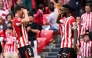 Athletic Bilbao's Spanish forward #09 Inaki Williams (R) celebrates with Athletic Bilbao's Spanish defender #04 Aitor Paredes after scoring their seventh goal during the Spanish league football match between Athletic Club Bilbao and Real Valladolid FC at San Mames Stadium in Bilbao on February 23, 2025. (Photo by ANDER GILLENEA / AFP)
