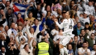 Real Madrid's Croatian midfielder #10 Luka Modric celebrates scoring the opening goal during the Spanish league football match between Real Madrid CF and Girona FC at Santiago Bernabeu Stadium in Madrid on February 23, 2025. (Photo by Pierre-Philippe Marcou / AFP)