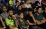 Pakistani cricket fans react as they watch a live broadcast of the ICC Champions Trophy one-day international (ODI) cricket match between India and Pakistan in Dubai, on a big screen in Karachi on February 23, 2025. (Photo by Asif Hassan / AFP)