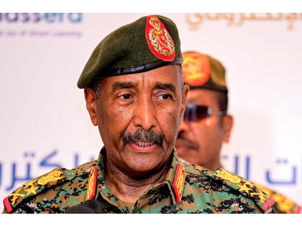 Sudan's army chief General Abdel Fattah Al-Burhan addresses the conference to support initiatives for e-learning projects and the enrichment of education infrastructure in the Darfur region and the launch of smart education platforms, in Port Sudan on February 17, 2025. (Photo by AFP)