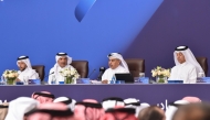 Chairman of QNB Group’s Board of Directors H E Ali Ahmed Al Kuwari with board members during the Extraordinary and Ordinary General Assembly Meeting, yesterday.