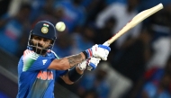 India's Virat Kohli hits the winning boundary and completes his century (100 runs) during the ICC Champions Trophy match between Pakistan and India in Dubai on February 23, 2025. (Photo by Jewel Samad / AFP)