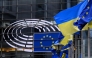 The European and Ukrainian flags are displayed in front of the Altiero-Spinelli building, the European Parliament in Brussels on February 24, 2025. (Photo by John Thys / AFP)