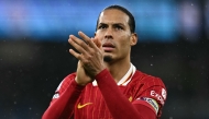 Liverpool's Dutch defender #04 Virgil van Dijk applauds the fans following the English Premier League football match between Manchester City and Liverpool at the Etihad Stadium in Manchester, north west England, on February 23, 2025. (Photo by Paul ELLIS / AFP)