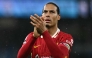 Liverpool's Dutch defender #04 Virgil van Dijk applauds the fans following the English Premier League football match between Manchester City and Liverpool at the Etihad Stadium in Manchester, north west England, on February 23, 2025. (Photo by Paul ELLIS / AFP)