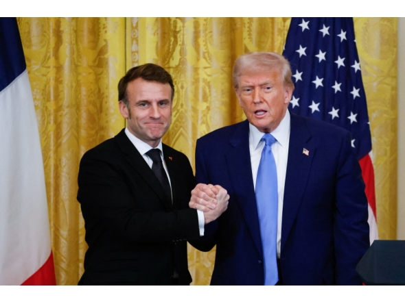 US President Donald Trump and French President Emmanuel Macron shake hands at the end of a joint press conference in the East Room to the White House in Washington, DC, on February 24, 2025. (Photo by Ludovic Marin / AFP)