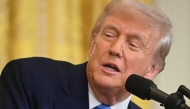 US President Donald Trump speaks during a joint press conference with French President Emmanuel Macron in the East Room to the White House in Washington, DC, on February 24, 2025. (Photo by Jim WATSON / AFP)
