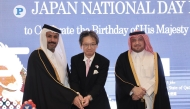 Minister of Commerce and Industry H E Sheikh Faisal bin Thani bin Faisal Al Thani (left); Director of MoFA Protocol Department H E Ambassador Ibrahim Yousif Abdullah Fakhro (right); and Ambassador of Japan H E Naoto Hisajima cut the cake at the reception yesterday. Pic: Ahmed Barakat/The Peninsula  