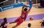 Qatar's Donte Grantham Mustafa Ndaw dunks the ball during the match.