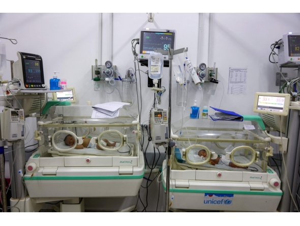 Prematurely-born infants lie in incubators at the neonatal intensive care unit (NICU) at the Patient Friend's Benevolent Society hospital in Gaza City on February 25, 2025. (Photo by Omar Al-Qattaa / AFP)