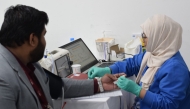 A staff member donates blood during the campaign recently.