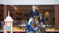 South Africa's Oliver Lazarus astride Butterfly Ennemmel celebrates his win in CSI3* 1.45m class.