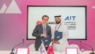 CEO of Aamal Company Rashid bin Ali Al Mansoori with Executive Vice President of Huawei Gulf North Alex Dai during the signing ceremony.