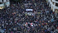 People gather during a demonstration to protest the regional government's response and call for the resignation of Valencia regional president Carlos Mazon, four months after devastating floods in Valencia, eastern Spain, on March 01, 2025. (Photo by JOSE JORDAN / AFP)
