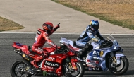 Winner Ducati Lenovo's Spanish rider Marc Marquez (L) and second-placed BK8 Gresini Racing MotoGP's Spanish rider Alex Marquez (R) celebrate after the MotoGP Thailand Grand Prix at the Buriram International Circuit in Buriram on March 2, 2025. (Photo by MOHD RASFAN / AFP)