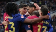 Barcelona's Uruguayan defender #04 Ronald Federico Araujo da Silva (C) celebrates scoring his team's third goal during the Spanish league football match between FC Barcelona and Real Sociedad at Estadi Olimpic Lluis Companys in Barcelona on March 2, 2025. (Photo by LLUIS GENE / AFP)
