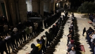 Palestinian devotees perform the evening 'Taraweeh' prayers at the Al Aqsa mosque compound in Jerusalem on February 28, 2025, on the eve of the Muslim holy fasting month of Ramadan. (Photo by AHMAD GHARABLI / AFP)