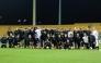 Al Sadd players and officials pose for a photograph at the Zabeel Stadium in Dubai.