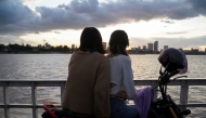 People ride a ferry at sunset on the Mekong River in Phnom Penh, Cambodia, on August 12, 2021. (Reuters File Photo)