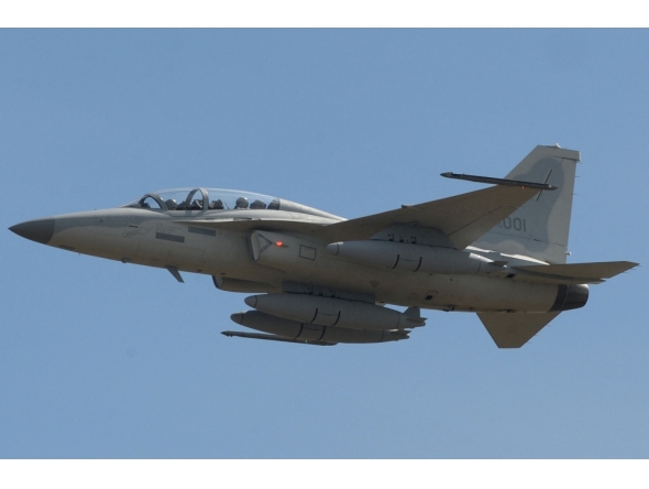 A Philippine Air Force FA-50 multirole light fighter aircraft flies past at the Clark Air Base in Angeles City, Pampanga province on November 18, 2015. (Photo by Ted Aljibe / AFP)