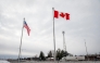 (Files) The Canadian and US flags fly near the Canada-US border in Blackpool, Quebec, Canada, on February 2, 2025.  (Photo by Andrej Ivanov / AFP)