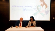 Dr. Hadi Mohamad Abu Rasheed (left), Scientific Advisor at QCS, and Nicole Alexander, founder of The Teal Society, signing the MoU recently.