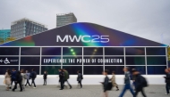 People walk towards the entrance of the MWC (Mobile World Congress), the world's biggest mobile fair, in Barcelona on March 3, 2025. Photo by Manaure QUINTERO / AFP