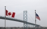 Trucks cross the Ambassador Bridge between Windsor, Canada and Detroit, Michigan on the first day of President Donald Trump's new 25% tariffs on goods from Canada and Mexico on March 4, 2025 in Windsor, Canada. (Photo by Bill Pugliano/Getty Images via AFP)