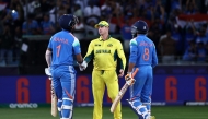 Australia's captain Steve Smith (C) shakes hands with India's KL Rahul as India's Ravindra Jadeja (R) watches at the end of the ICC Champions Trophy one-day international (ODI) semi-final cricket match between Australia and India at the Dubai International Stadium in Dubai on March 4, 2025. (Photo by FADEL SENNA / AFP)
