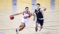 Al Rayyan’s Tyler James Lee Harris (left) dribbles while an Al Sadd player attempts to defend. 