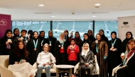 Qatar women’s cycling team coach Noura Al Amiri and officials with the award winners of the Cycle Her Way programme.