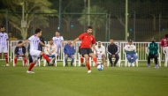 Participants play football at the festival.