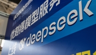 The logo of Deepseek is seen during the Global Developer Conference, organised by the Shanghai AI Industry Association, in Shanghai on February 21, 2025. Photo by Hector RETAMAL / AFP