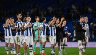 Real Sociedad players react at the end of the UEFA Europa League Round of 16 first let football match between Real Sociedad and Manchester United at Anoeta Stadium in San Sebastian on March 6, 2025. (Photo by ANDER GILLENEA / AFP)
