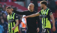 Manchester City's Spanish manager Pep Guardiola (C) consoles Manchester City's Croatian midfielder #08 Mateo Kovacic (L) after the English Premier League football match between Nottingham Forest and Manchester City at The City Ground in Nottingham, central England, on March 8, 2025. (Photo by Darren Staples / AFP)