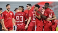 Al Duhail players celebrate during the match.